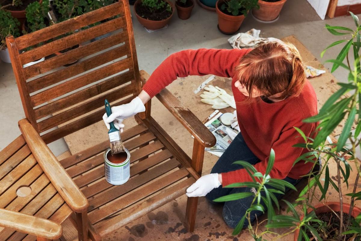woman-painting-wooden-chair